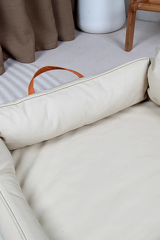 Large Dog Bed Leather Soft Plush Donut Snuggly Warm Cozy Pet Mat for S in neutral color with handles visible.