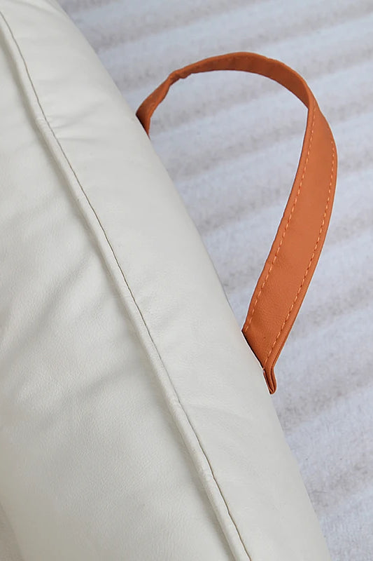 Large Dog Bed Leather Soft Plush Donut Snuggly Warm Cozy Pet Mat for S with an orange handle for easy transport.