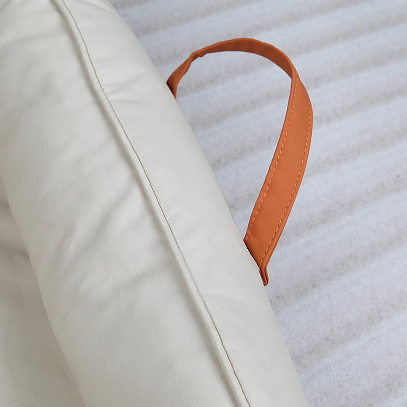 Large Dog Bed Leather Soft Plush Donut Snuggly Warm Cozy Pet Mat for S with an orange handle for easy transport.