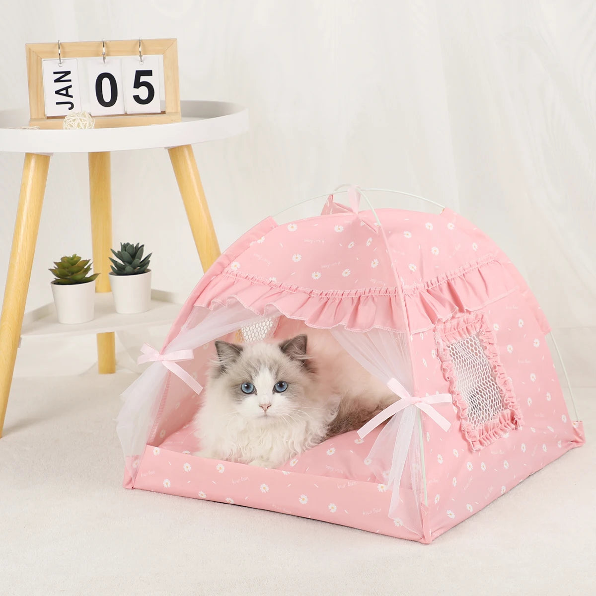 Pet Tent Bed for Cats Cozy Winter Cat House provides a warm, comfortable, and secure sleeping space for cats and small pets. Made with soft plush materials and a cozy enclosed design, it helps pets stay warm during colder seasons while offering privacy and comfort for everyday relaxation.