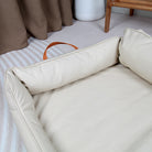 Large Dog Bed Leather Soft Plush Donut Snuggly Warm Cozy Pet Mat for S in neutral color with handles visible.